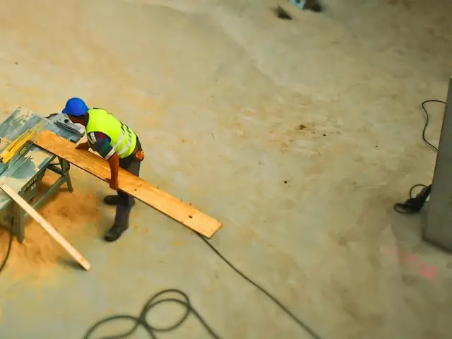 Circular saw cutting timber on a site floor, seen from above