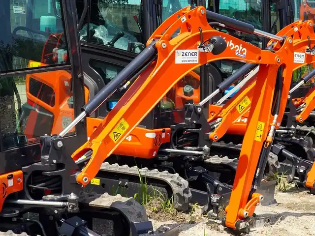 Fleet of compact excavators on a plant yard