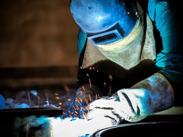 Welder at work in a fabrication workshop