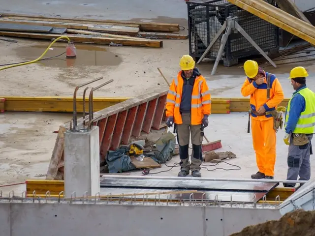 Site crew in hi-vis and hard hats on a concrete deck