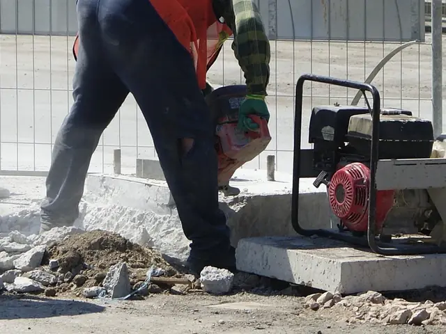 Abrasive cut-off disc cutting through concrete